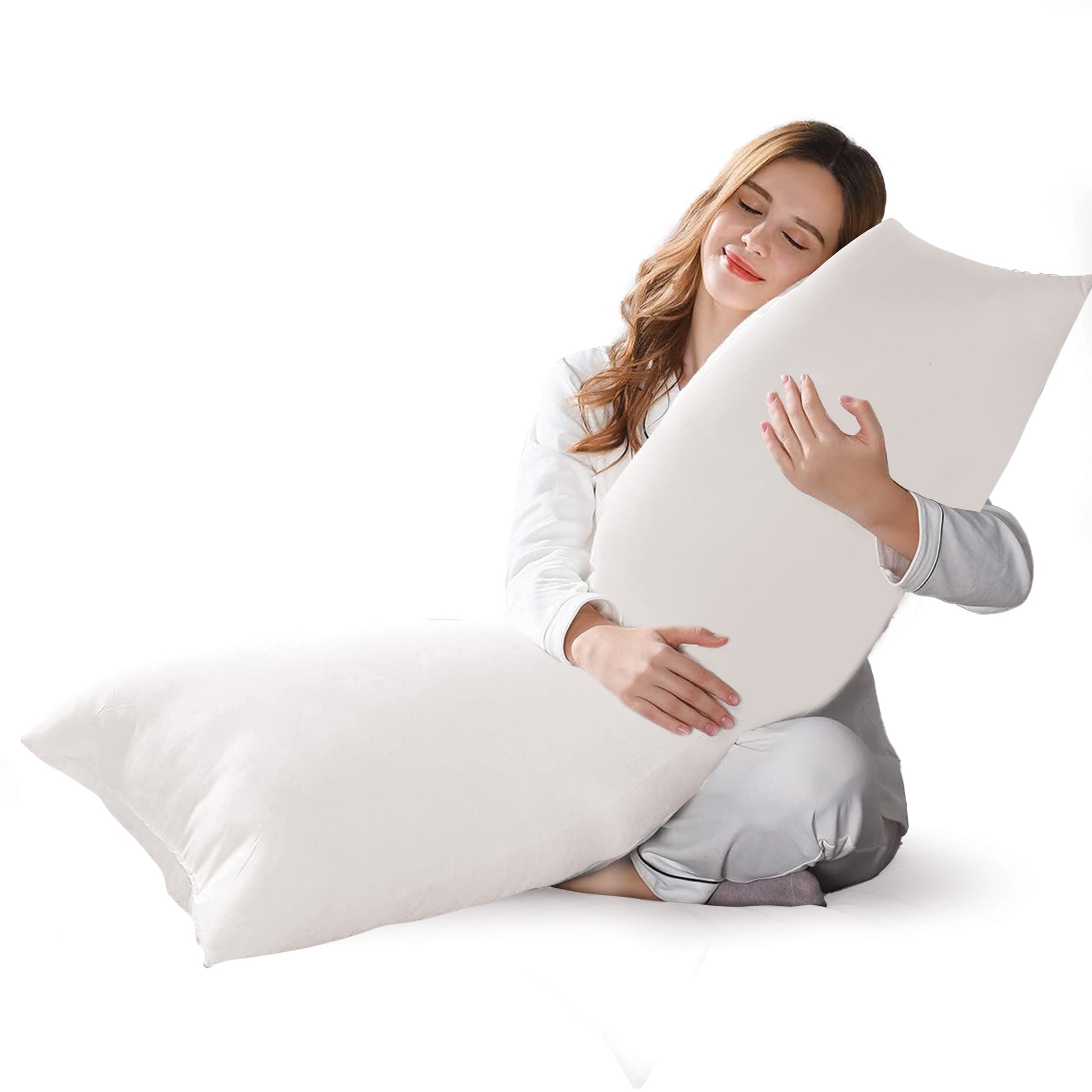 In her embrace, the woman holds a body pillow filled with a balanced blend of 50% down and 50% feathers, offering the perfect harmony of softness and support for a blissful night's sleep